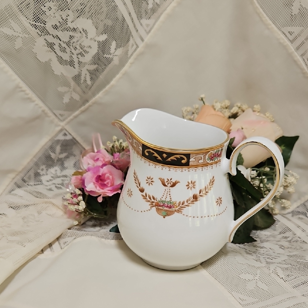 Elegant Gold and White Porcelain Pitcher